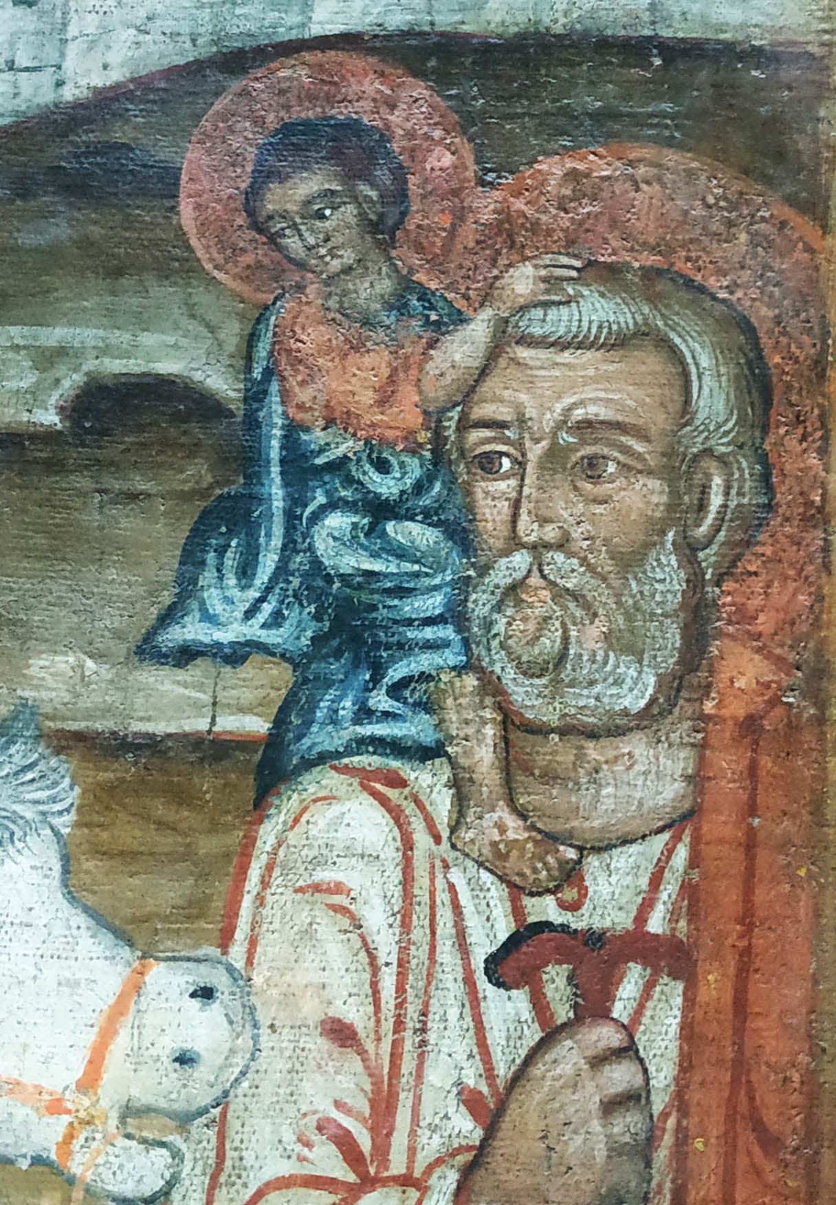 Jesus sitting on St. Joseph’s right shoulder